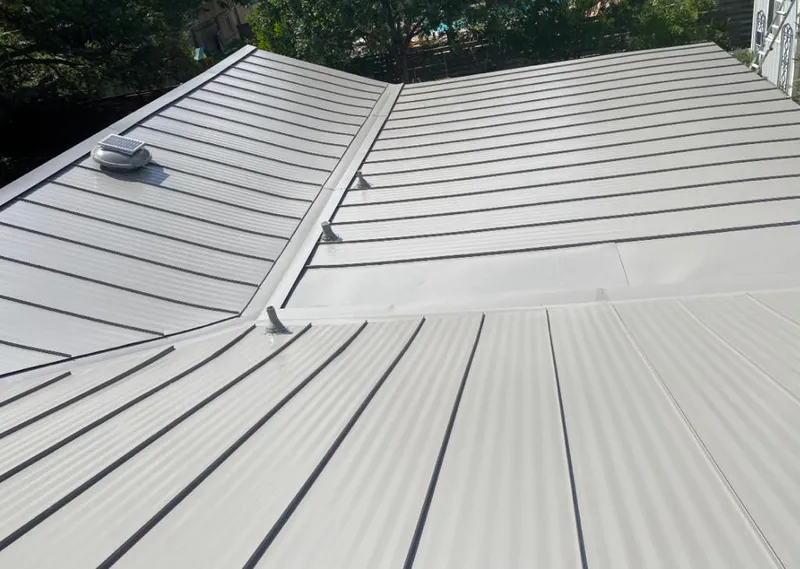 Solar attic fan installed on a metal roof for Roof Ventilation in Upper Leacock